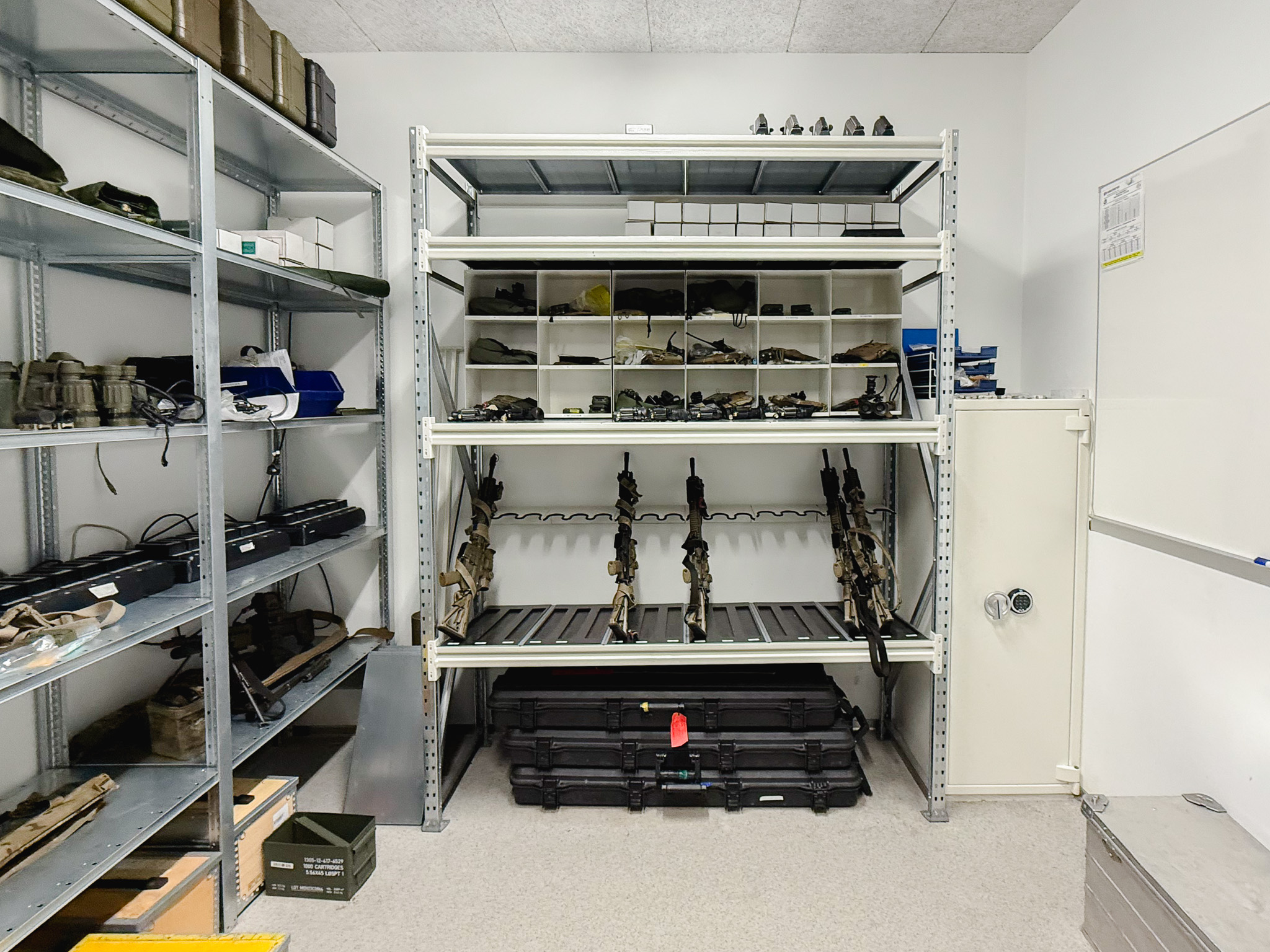 Weapon armoury using DSS shelving with gun racks and storage for weapon accessories