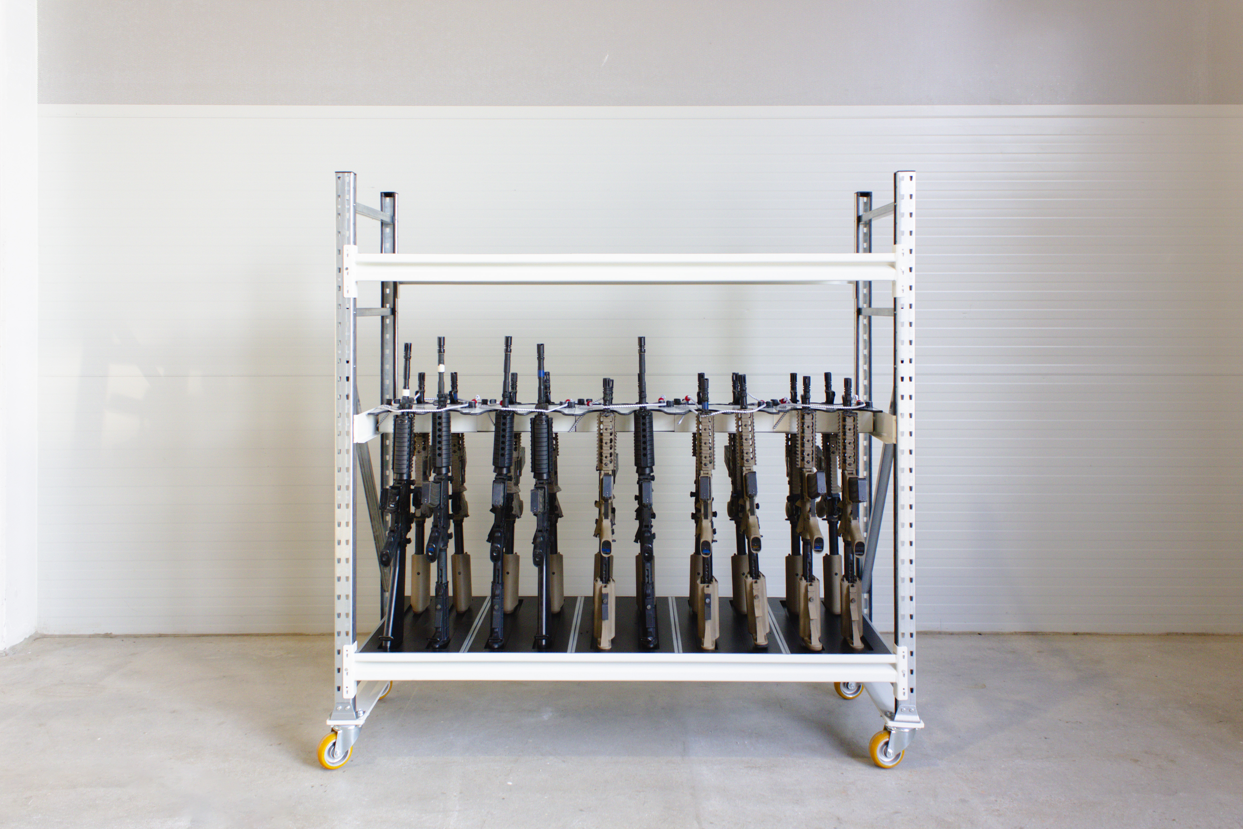 Mobile DSS shelving with wheels, with gun rack accessories 